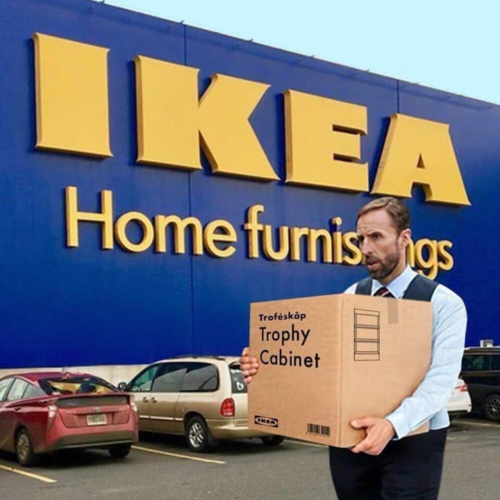 Garath Southgate carrying a trophy cabinet box outside IKEA